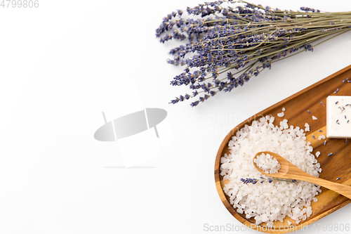 Image of sea salt heap, lavender and spoon on wooden tray