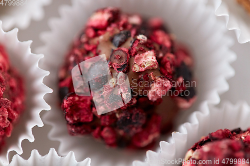 Image of close up of different candies in paper cups