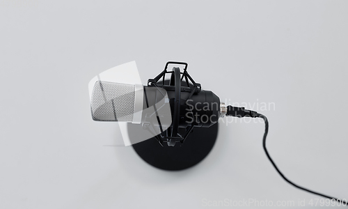 Image of close up of microphone on white background