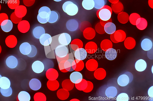 Image of Unfocused bright holiday lights background