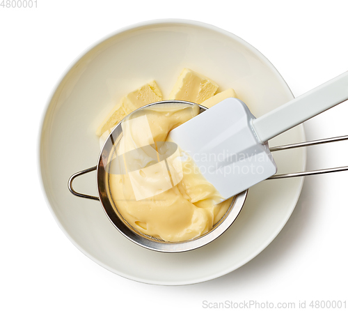 Image of custard cream in a strainer