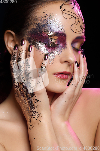 Image of beautiful woman with bright makeup with glitter
