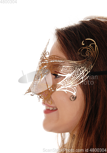 Image of Close up image of woman with gold mask