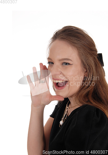 Image of Young beautiful woman screaming 