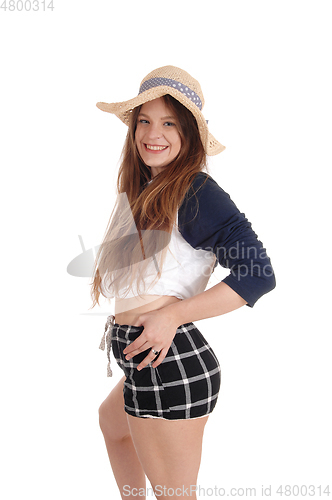 Image of Beautiful woman with a straw hat and black shorts