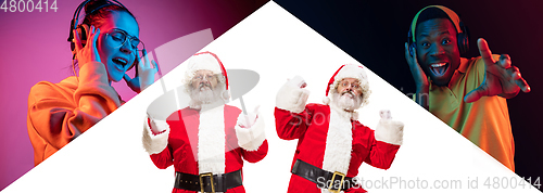 Image of Emotional Santa Claus and his entourage greeting with New Year and Christmas