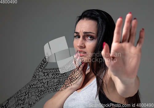 Image of Woman in fear of domestic abuse and violence, concept of female rights