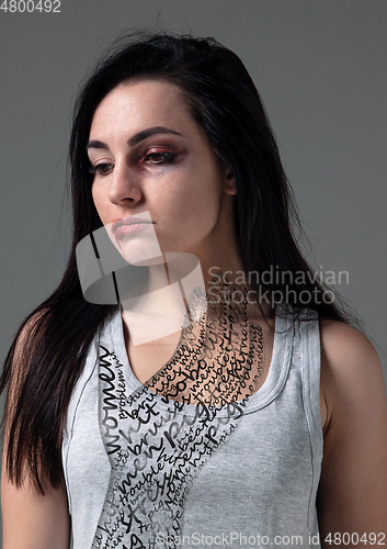 Image of Woman in fear of domestic abuse and violence, concept of female rights