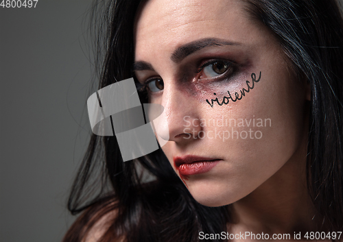 Image of Woman in fear of domestic abuse and violence, concept of female rights