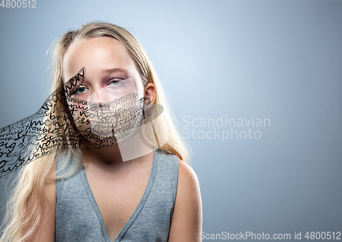 Image of Sad and frightened little girl with bloodshot and bruised eyes, fiction of happiness