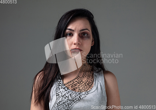 Image of Woman in fear of domestic abuse and violence, concept of female rights