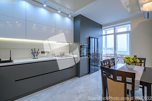 Image of Luxury white and dark grey modern kitchen interior