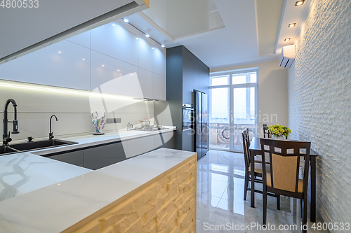 Image of Luxury white and dark grey modern kitchen interior