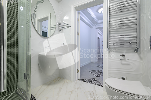 Image of Modern luxury white and chrome bathroom