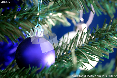 Image of Christmas ornaments on tree.