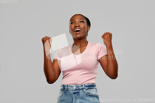 Image of happy african american woman celebrating success