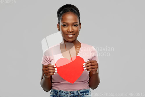 Image of happy african american woman with red heart