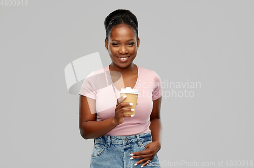 Image of happy african american woman drinking coffee