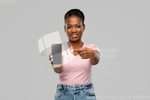 Image of happy african american woman using smartphone