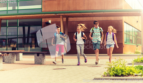 Image of group of happy elementary school students running