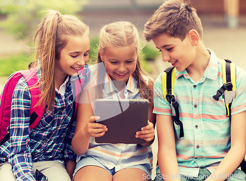 Image of group of happy elementary school students talking