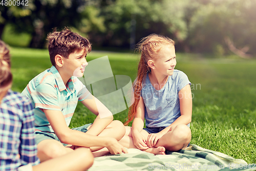 Image of group of happy kids or friends outdoors