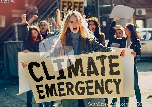 Image of Young people protesting of climate emergency on the street