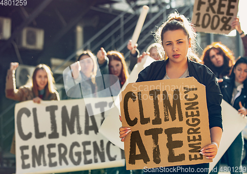 Image of Young people protesting of climate emergency on the street