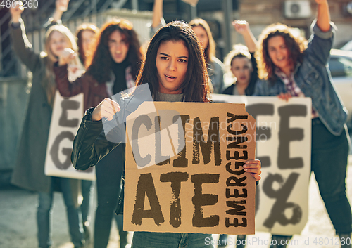 Image of Young people protesting of climate emergency on the street