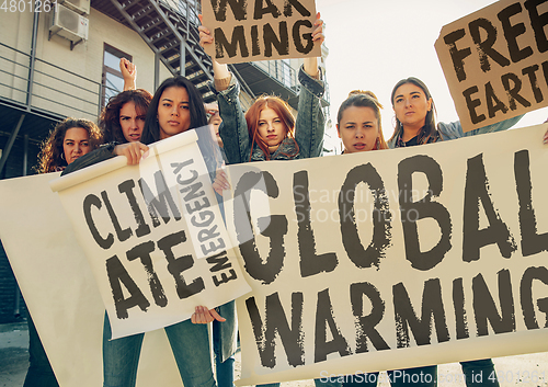 Image of Young people protesting of climate emergency on the street