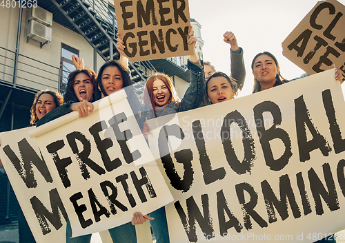 Image of Young people protesting of climate emergency on the street