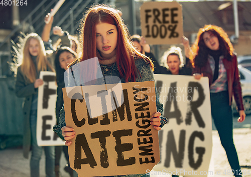 Image of Young people protesting of climate emergency on the street