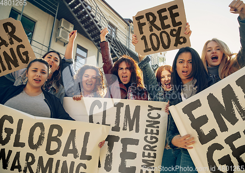 Image of Young people protesting of climate emergency on the street