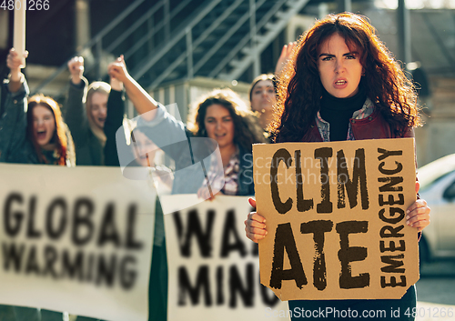 Image of Young people protesting of climate emergency on the street