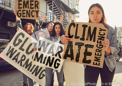 Image of Young people protesting of climate emergency on the street