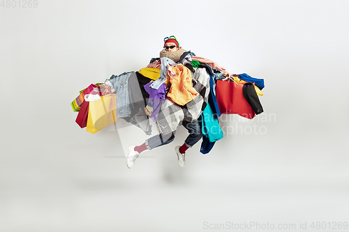 Image of Man addicted of sales and clothes, overproduction and crazy demand