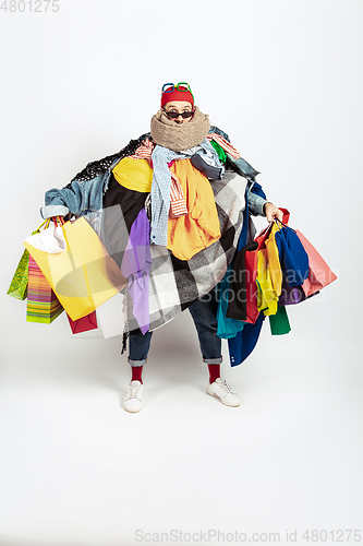 Image of Man addicted of sales and clothes, overproduction and crazy demand