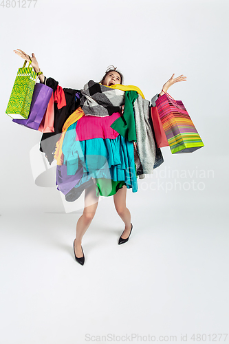 Image of Woman addicted of sales and clothes, overproduction and crazy demand