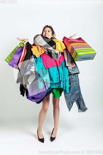 Image of Woman addicted of sales and clothes, overproduction and crazy demand