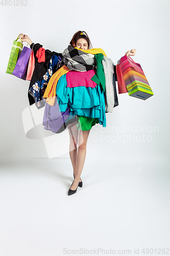 Image of Woman addicted of sales and clothes, overproduction and crazy demand