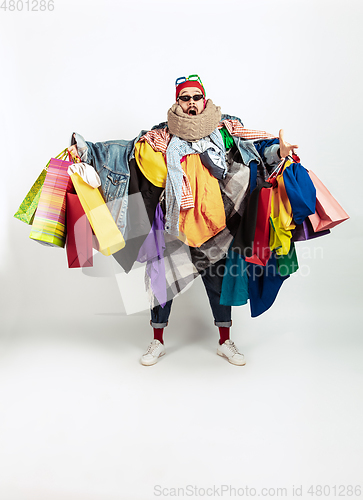 Image of Man addicted of sales and clothes, overproduction and crazy demand