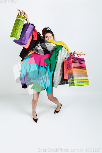 Image of Woman addicted of sales and clothes, overproduction and crazy demand