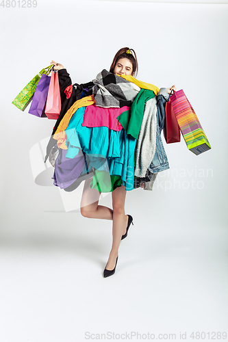 Image of Woman addicted of sales and clothes, overproduction and crazy demand