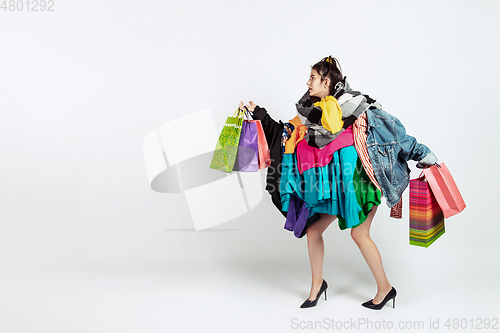 Image of Woman addicted of sales and clothes, overproduction and crazy demand