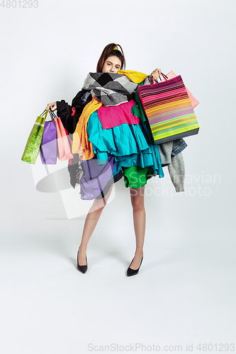 Image of Woman addicted of sales and clothes, overproduction and crazy demand