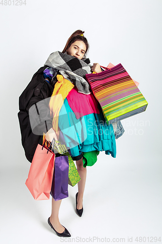 Image of Woman addicted of sales and clothes, overproduction and crazy demand