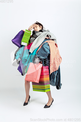 Image of Woman addicted of sales and clothes, overproduction and crazy demand
