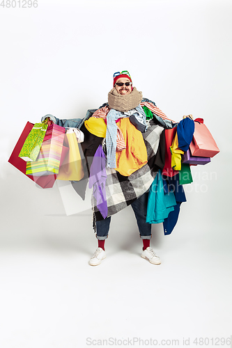 Image of Man addicted of sales and clothes, overproduction and crazy demand