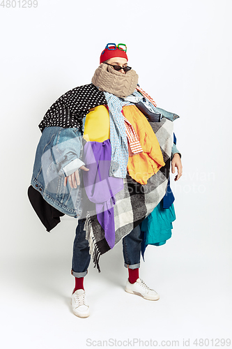 Image of Man addicted of sales and clothes, overproduction and crazy demand