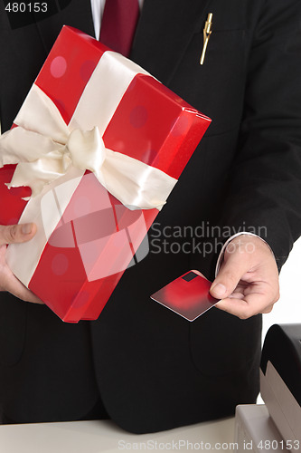 Image of Man makes a Christmas purchase